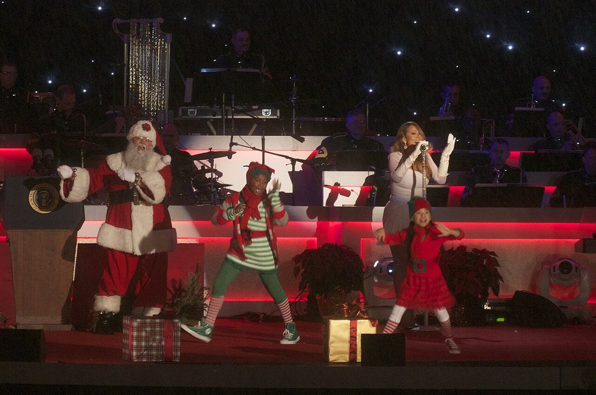 Mariah Carey on a festive stage during a December 2013 Christmas concert